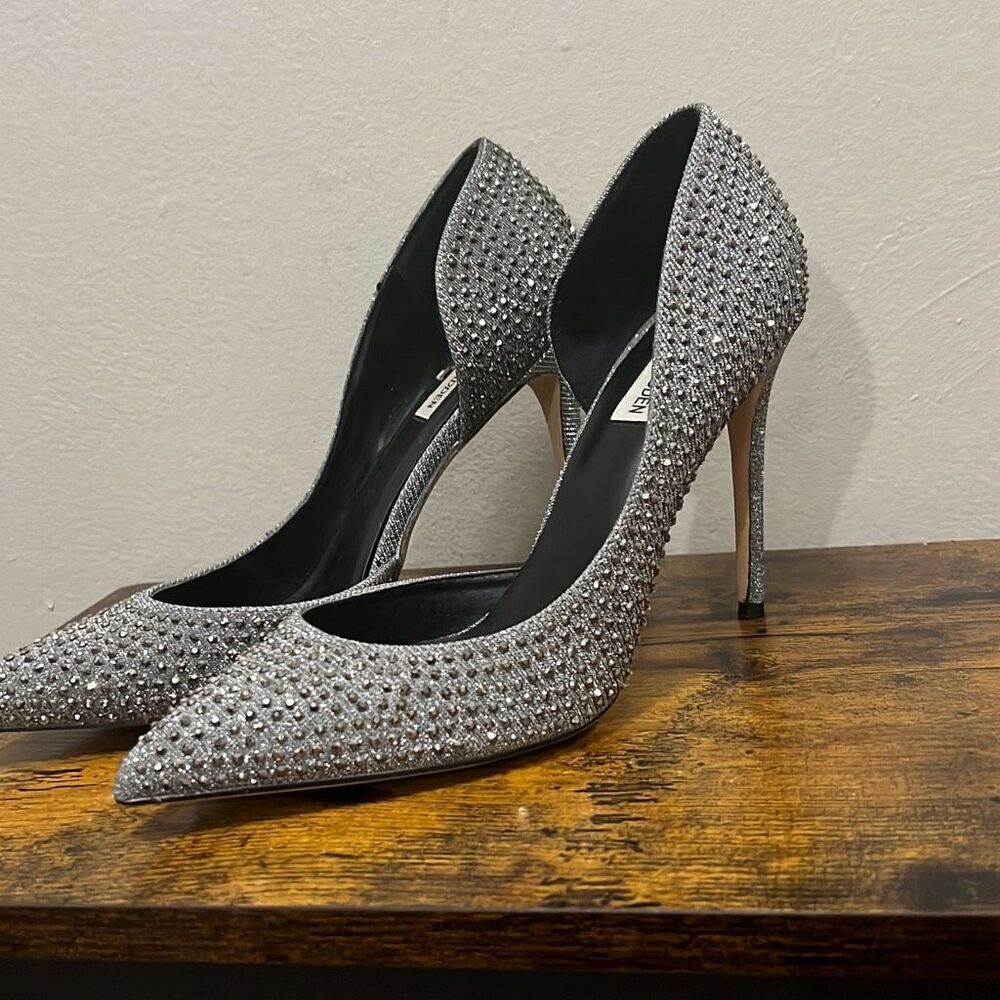 Steve Madden silver sparkles and shimmery rhinestones pointed toe stilettos. Siz